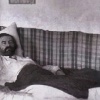 Kazimir Malevich lying ill in his bed.
